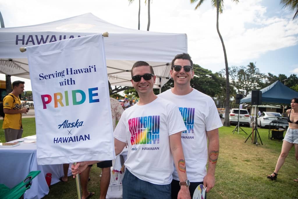 People Holding Pride Banner